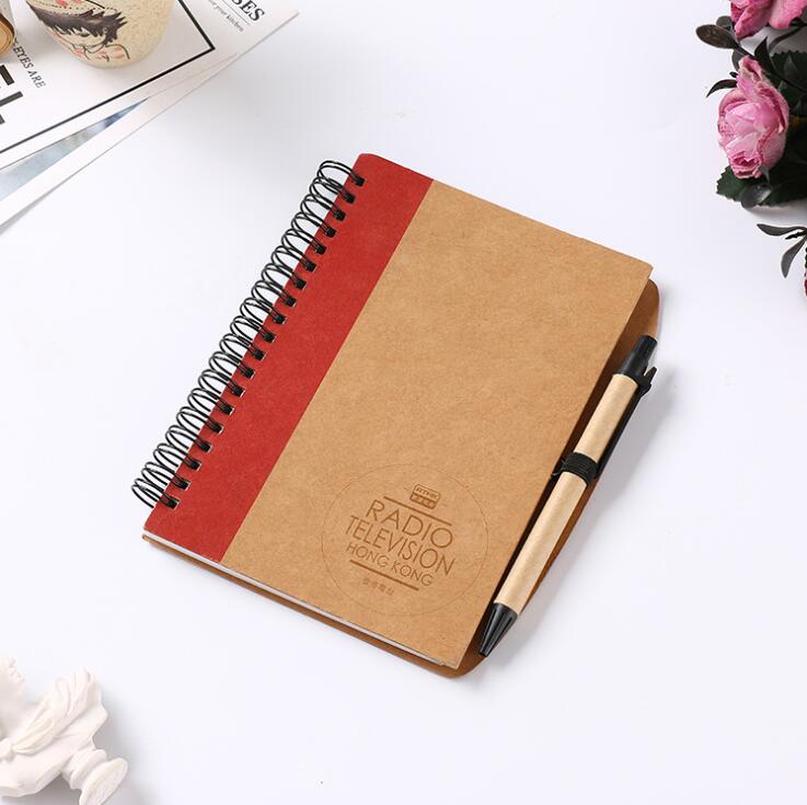 spiral notebook with pen